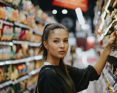 woman shopping in a premium grocery store