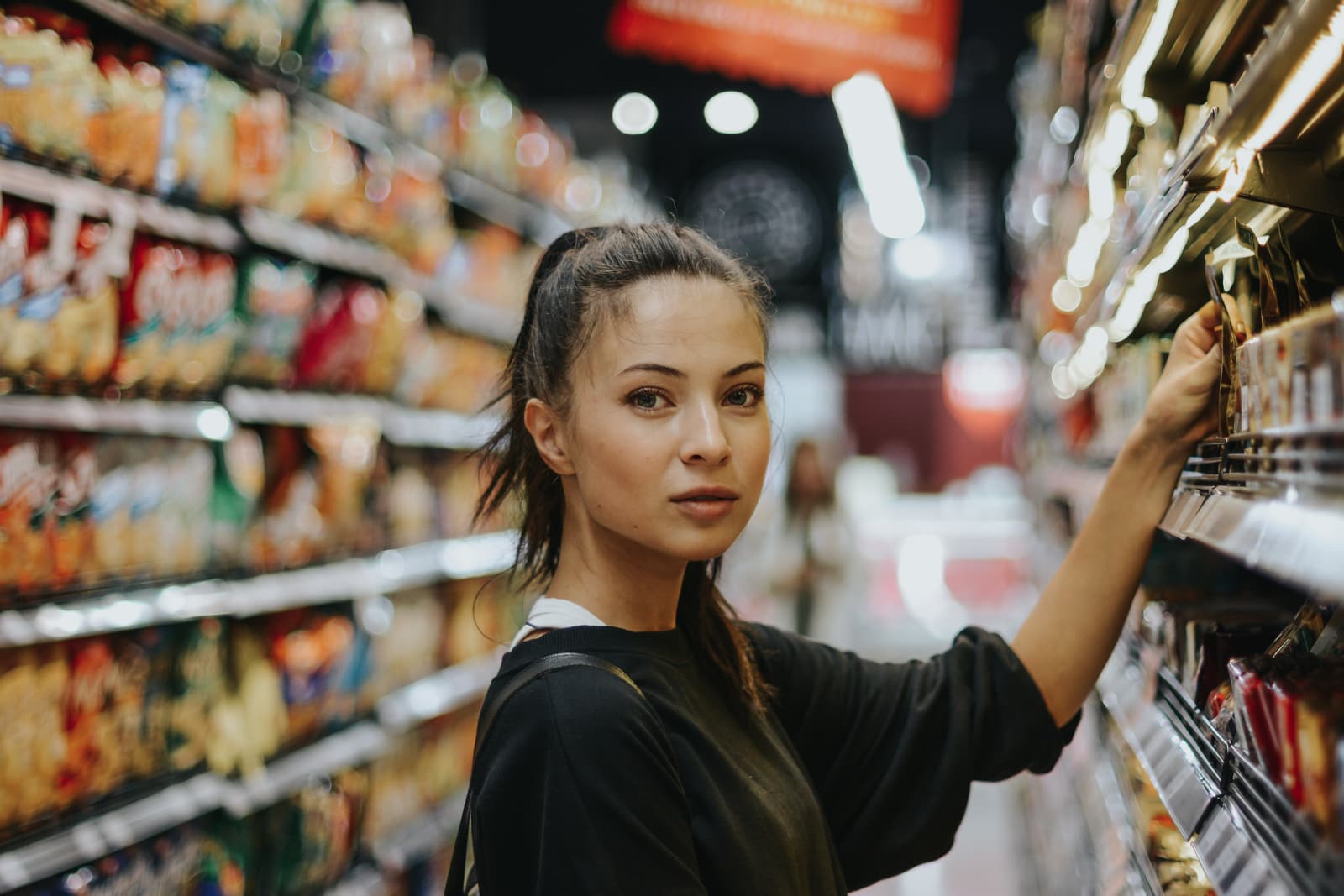 woman shopping in a premium grocery store