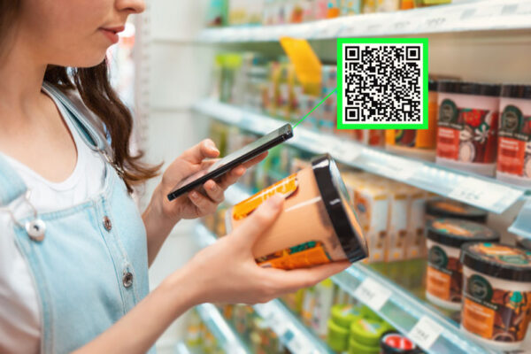 woman scanning tub of product with mobile qr scanner